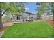 Large, grassy backyard with a patio, outdoor furniture, and a trampoline, perfect for Gathering activities at 877 Eldorado Dr, Superior, CO 80027