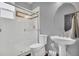 Bright bathroom features a white tiled shower with glass door, modern sink and fixtures, and gray wall paint at 877 Eldorado Dr, Superior, CO 80027
