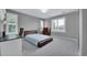 Bedroom with neutral walls, shuttered windows, and a bed with wooden trim at 877 Eldorado Dr, Superior, CO 80027