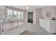 Charming bedroom with a pink wall color, bright white trim, and a chandelier at 877 Eldorado Dr, Superior, CO 80027