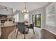 Cozy dining space with stylish rug and view to the home's high-ceiling living area at 877 Eldorado Dr, Superior, CO 80027
