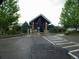 A brick community center with a glass front and 2 benches on each side of the entrance at 877 Eldorado Dr, Superior, CO 80027