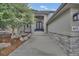 Charming front entrance featuring stone accents, a covered porch, and a well-manicured landscape at 877 Eldorado Dr, Superior, CO 80027