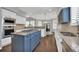 Modern kitchen design with gas cooktop island, stainless appliances, and dining nook at 877 Eldorado Dr, Superior, CO 80027