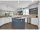 Well-appointed kitchen with island cooktop, stainless steel appliances, and designer backsplash at 877 Eldorado Dr, Superior, CO 80027
