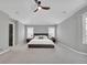 Spacious main bedroom suite with ceiling fan, carpet, and neutral paint at 877 Eldorado Dr, Superior, CO 80027