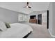 Spacious main bedroom with a vaulted ceiling, ceiling fan, and a window with shutters at 877 Eldorado Dr, Superior, CO 80027