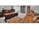 Spacious office features a large desk, comfortable leather couch, built-in bookshelf, and natural light at 877 Eldorado Dr, Superior, CO 80027