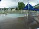 A shallow circular pool in a community area with a blue canopy at 877 Eldorado Dr, Superior, CO 80027