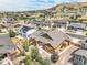 Aerial view of house, neighborhood, and mountain backdrop at 3995 Manorbrier Cir, Castle Rock, CO 80104