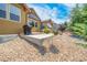 Home's backyard features a patio, landscaping, and a grill at 3995 Manorbrier Cir, Castle Rock, CO 80104