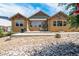 Home's backyard features a patio and attractive landscaping at 3995 Manorbrier Cir, Castle Rock, CO 80104