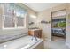Elegant bathroom with a soaking tub and walk-in shower at 3995 Manorbrier Cir, Castle Rock, CO 80104