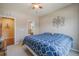 Charming bedroom with a queen bed and access to a bathroom at 3995 Manorbrier Cir, Castle Rock, CO 80104