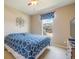 Comfortable bedroom with a queen-size bed and a TV at 3995 Manorbrier Cir, Castle Rock, CO 80104
