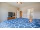 Well-lit bedroom with a queen bed and private bathroom at 3995 Manorbrier Cir, Castle Rock, CO 80104