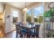 Bright breakfast nook with table and chairs, overlooking backyard at 3995 Manorbrier Cir, Castle Rock, CO 80104