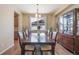 Dining room features a large table, six chairs, and a hutch at 3995 Manorbrier Cir, Castle Rock, CO 80104