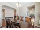 Bright dining room with a table, chairs, and kitchen view at 3995 Manorbrier Cir, Castle Rock, CO 80104