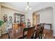 Spacious dining room with a large wooden table and six chairs at 3995 Manorbrier Cir, Castle Rock, CO 80104