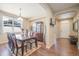 Bright dining room features a wood table, six chairs, and a built-in hutch at 3995 Manorbrier Cir, Castle Rock, CO 80104