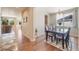 Open dining room with hardwood floors and natural light at 3995 Manorbrier Cir, Castle Rock, CO 80104