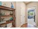 Bright hallway with built-in shelving and view into adjacent room at 3995 Manorbrier Cir, Castle Rock, CO 80104