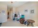 Home office with built-in shelving and view of bathroom at 3995 Manorbrier Cir, Castle Rock, CO 80104