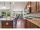 Modern kitchen with granite countertops, stainless steel appliances and hardwood floors at 3995 Manorbrier Cir, Castle Rock, CO 80104