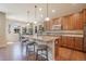 Island kitchen with granite countertops and hardwood floors at 3995 Manorbrier Cir, Castle Rock, CO 80104