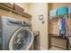 Laundry room with washer, dryer, and ample storage at 3995 Manorbrier Cir, Castle Rock, CO 80104