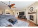 Relaxing living room with sectional sofa, fireplace, and TV at 3995 Manorbrier Cir, Castle Rock, CO 80104