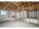 Unfinished basement with framed walls and flooring at 3995 Manorbrier Cir, Castle Rock, CO 80104