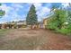 Sprawling backyard with large trees, grass, and outdoor space, great for recreation at 2166 S Joplin Way, Aurora, CO 80013