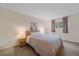 Serene bedroom with soft lighting, neutral tones, and a comfortable bed, perfect for relaxation at 2166 S Joplin Way, Aurora, CO 80013