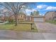 Charming two-story home with a well-manicured front yard, a driveway, and an attached two car garage at 2166 S Joplin Way, Aurora, CO 80013