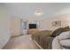 Spacious main bedroom with plush carpeting, a large bed, and a relaxing atmosphere at 2166 S Joplin Way, Aurora, CO 80013