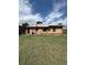 Spacious backyard view of this home's brick exterior at 460 Yates St, Denver, CO 80204
