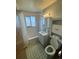 Vintage bathroom featuring tile floors, bath and shower combination, and built in shelving at 460 Yates St, Denver, CO 80204