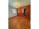 Bedroom with hardwood floors, built-in wardrobes, and a vintage chandelier at 460 Yates St, Denver, CO 80204