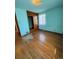 Bedroom with hardwood floors, built-ins, and natural light at 460 Yates St, Denver, CO 80204