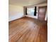Bright living room featuring hardwood floors and a large window at 460 Yates St, Denver, CO 80204