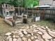 Backyard features a chicken coop, garden beds, and a charming arrangement of stone pavers for a rustic look at 943 Pinon Ct, Longmont, CO 80504