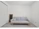 Neutral bedroom featuring carpet floors and a light gray sofa, creating a clean, relaxing space at 943 Pinon Ct, Longmont, CO 80504