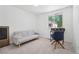Bright bedroom featuring a daybed, and large window, perfect for a home office at 943 Pinon Ct, Longmont, CO 80504