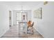 Bright dining area with table, chairs, and sliding door to the backyard at 943 Pinon Ct, Longmont, CO 80504