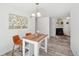 Cozy dining area featuring a table, chairs, and fireplace in the background at 943 Pinon Ct, Longmont, CO 80504