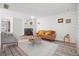 Inviting living room featuring a fireplace, wood floors, and comfortable seating at 943 Pinon Ct, Longmont, CO 80504