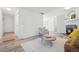 Spacious living room with fireplace, wood floors, and an open layout at 943 Pinon Ct, Longmont, CO 80504