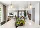 Stylish open-concept layout connecting the kitchen, dining, and living areas with modern finishes at 16648 W 92Nd Pl, Arvada, CO 80007